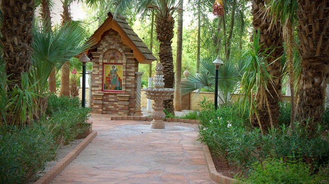 Кирпичный кивот над иконой вмч. Димитрия Солунского в монастырском саду.